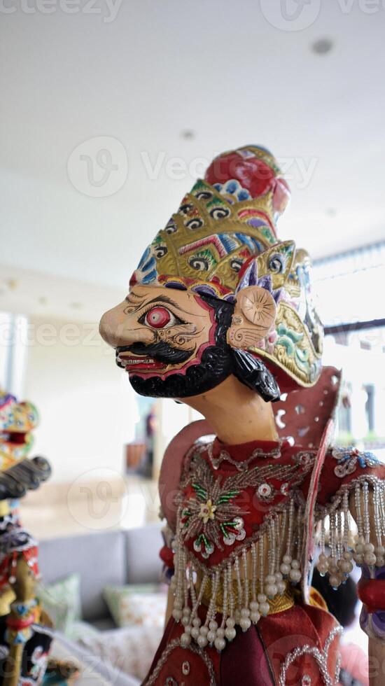 Indonesian authentic wayang golek, wooden carved rod puppet. photo