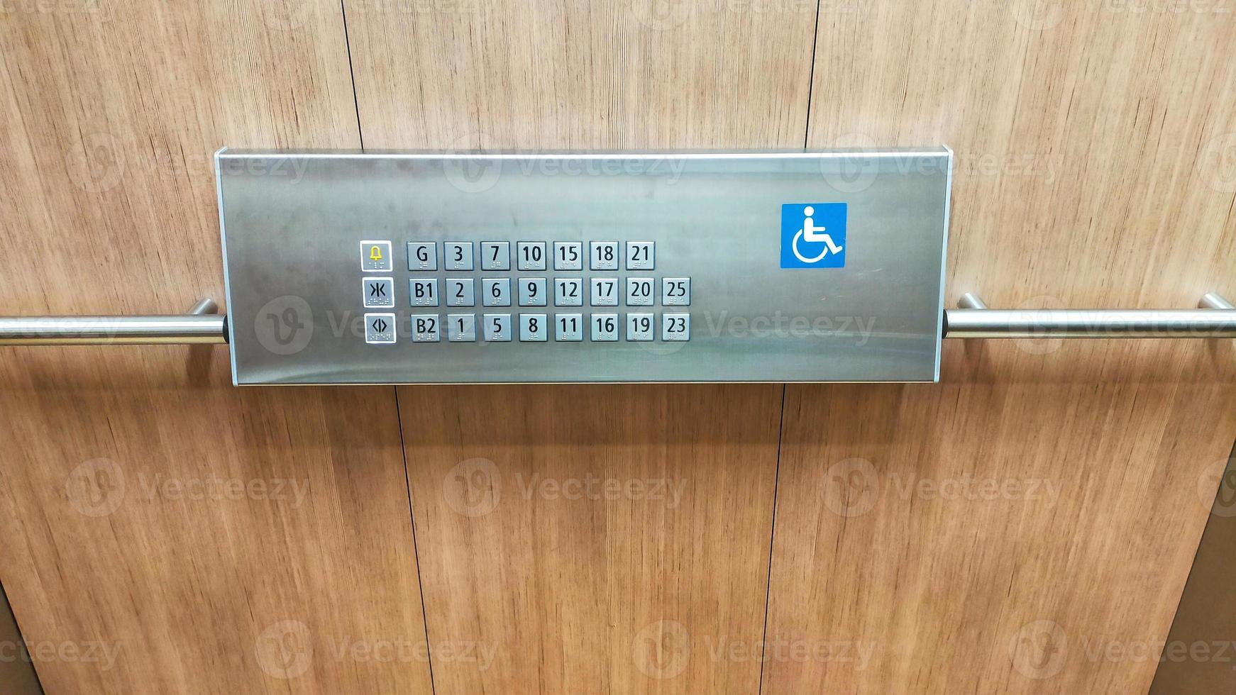 The disabled elevator button or panel with braille code of the elevator lift. photo