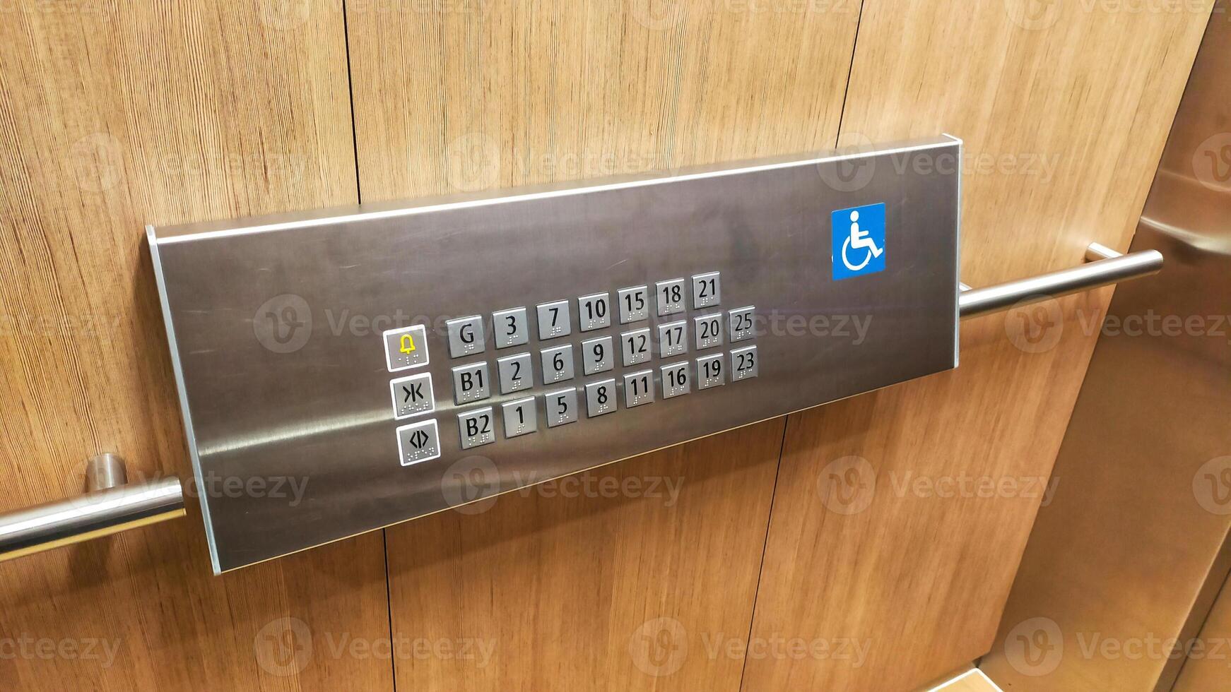 The disabled elevator button or panel with braille code of the elevator. photo