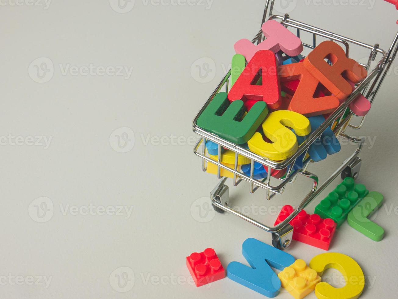 The wood Alphabet multi colour in supermarket cart  for kid or education concept photo