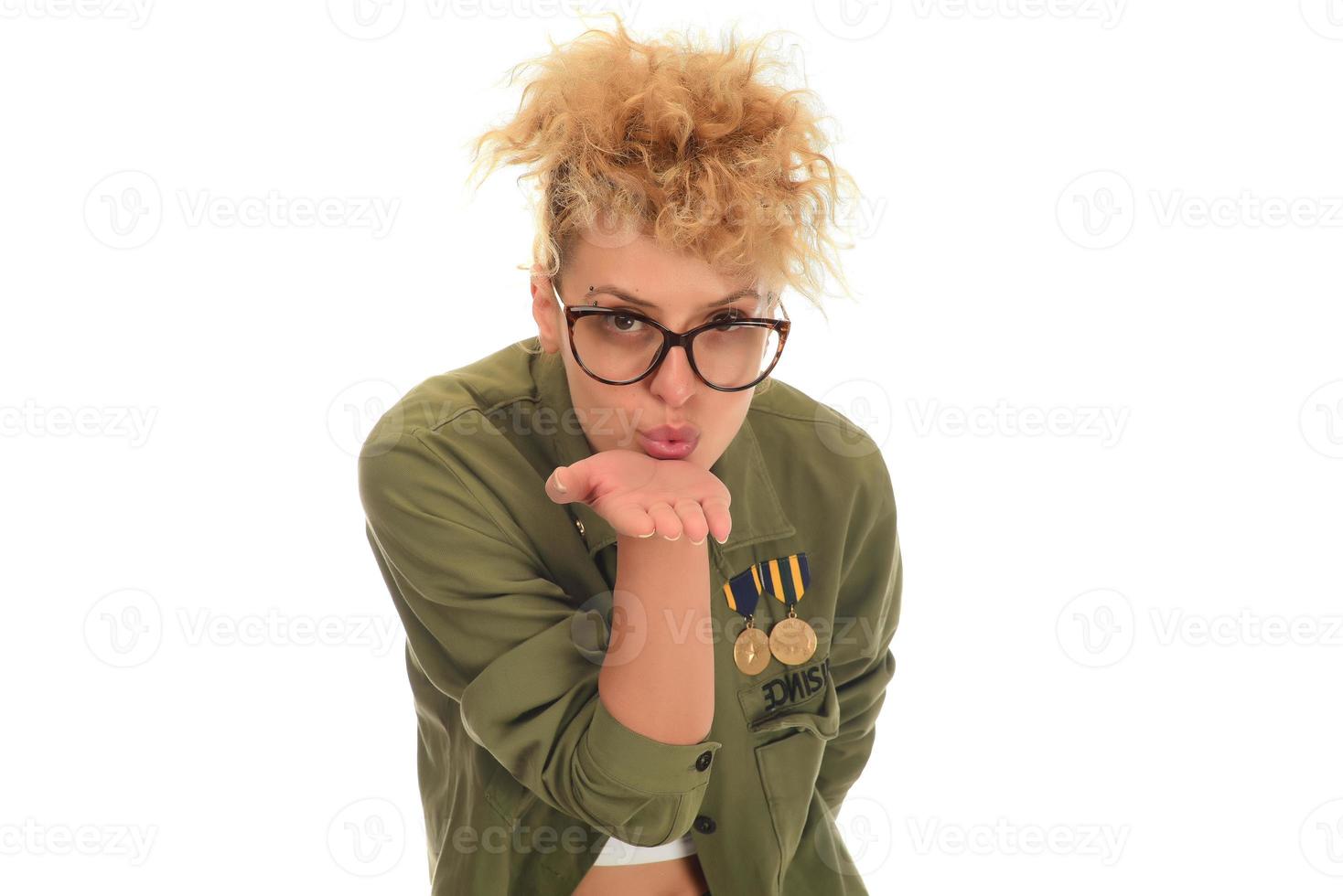 beautiful modern blonde woman with eye glasses posing over a white background photo