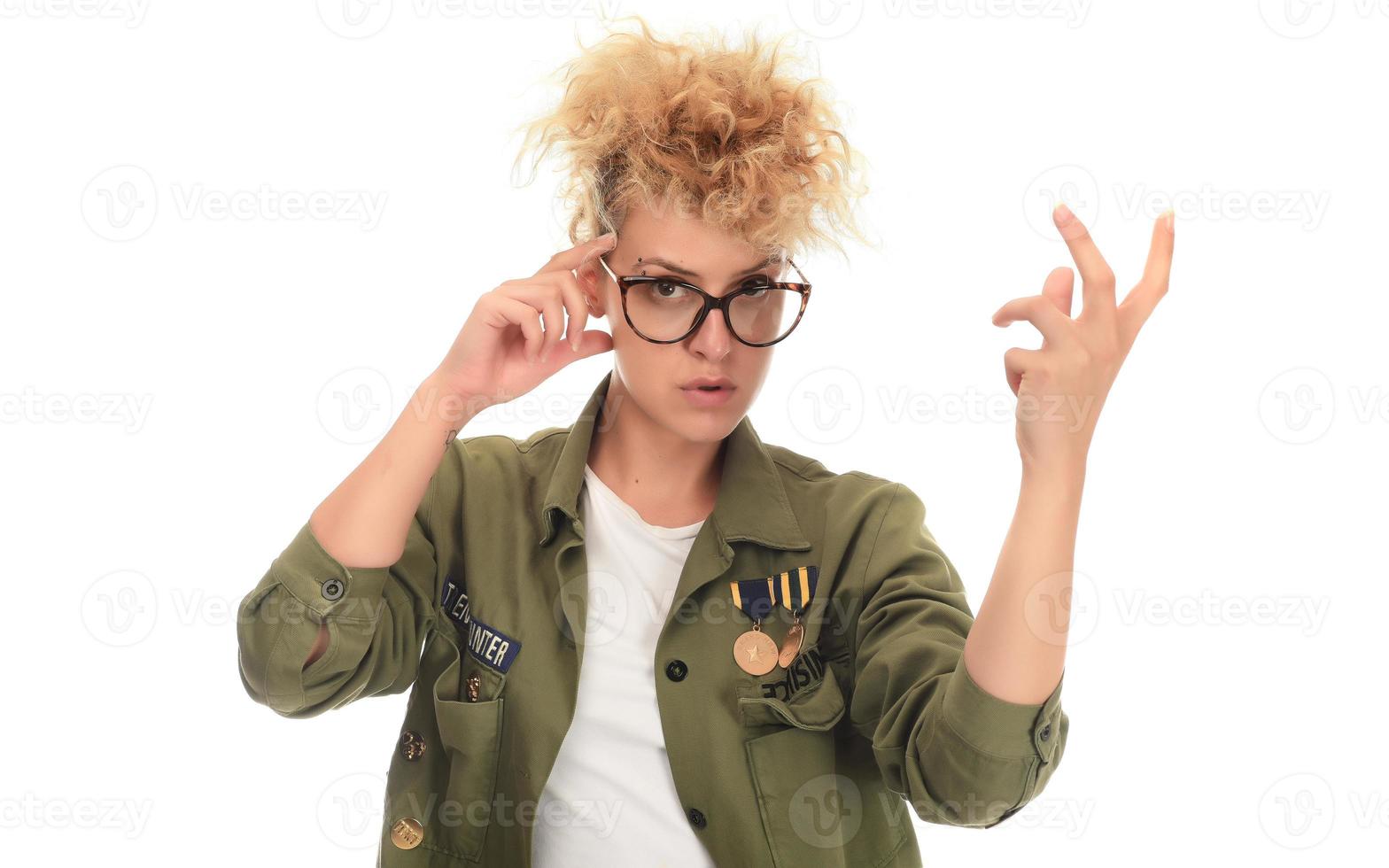 beautiful modern blonde woman with eye glasses posing over a white background photo