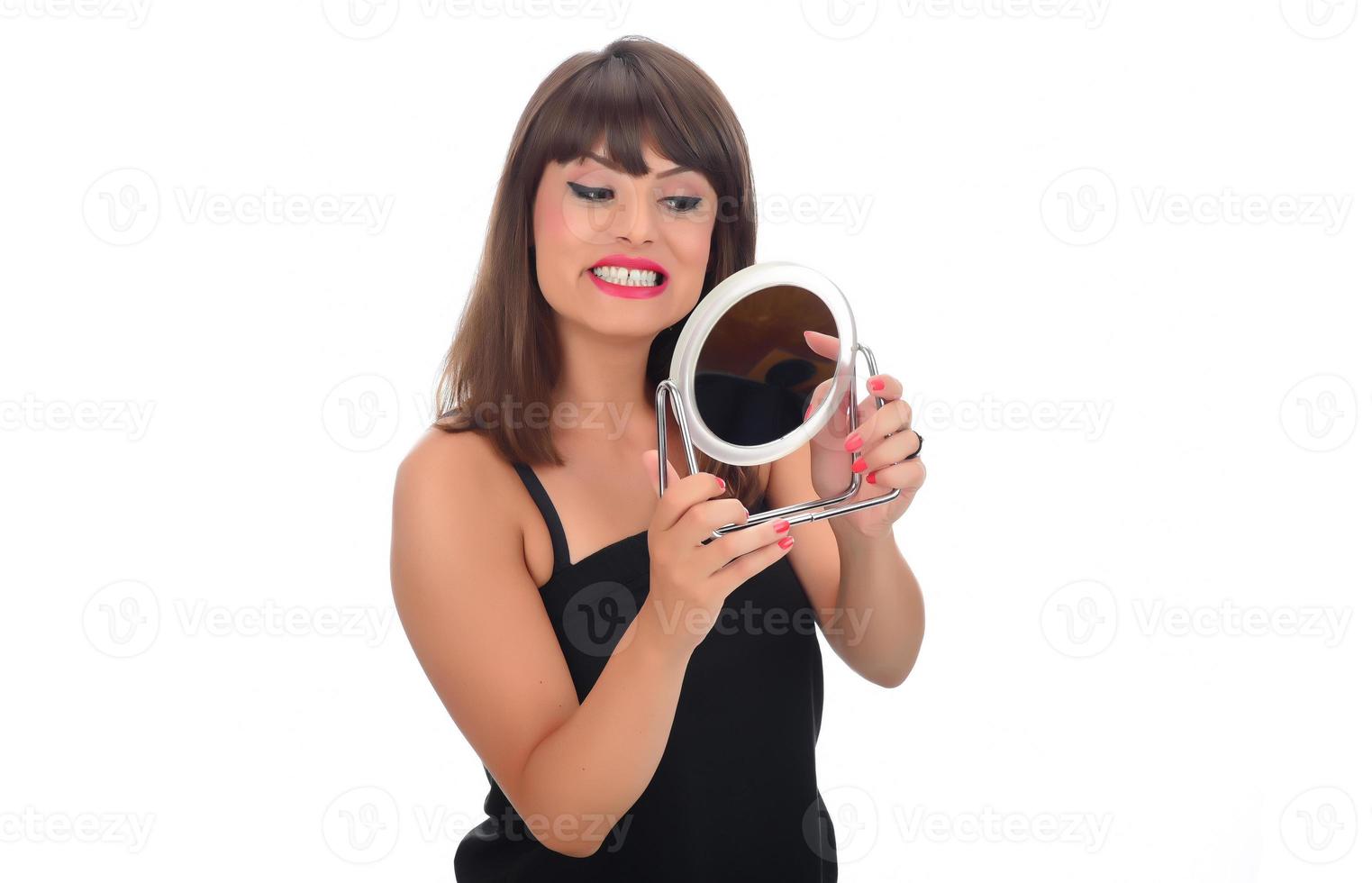 Portrait of attractive delicate feminine cheery girl touching smooth silky skin photo