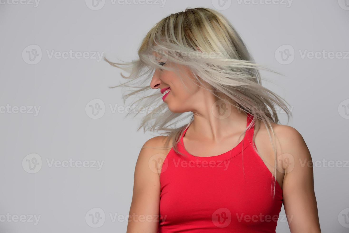 Happy satisfied woman with flying hair photo