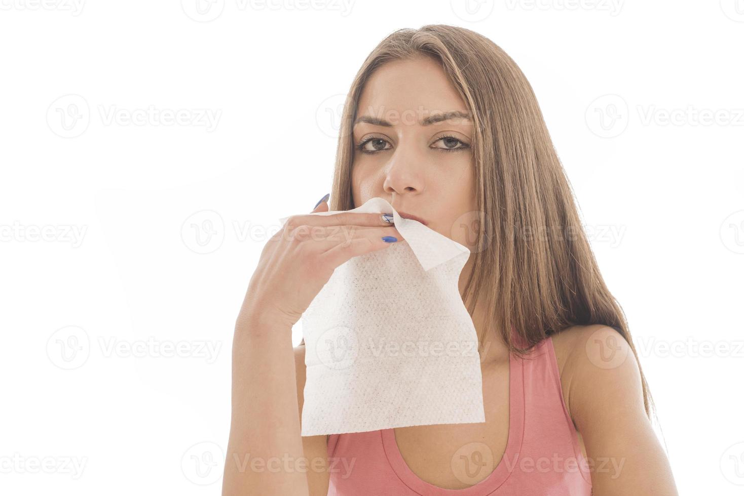 Beautiful woman sitting in front of a mirror. face of a healthy woman applying cream and makeup. Advertisement for skin cream, anti-wrinkle cream, baby face photo