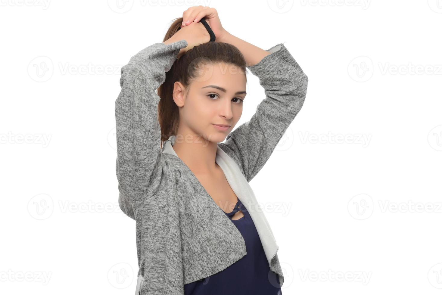 The woman is grabbing her hair. photo