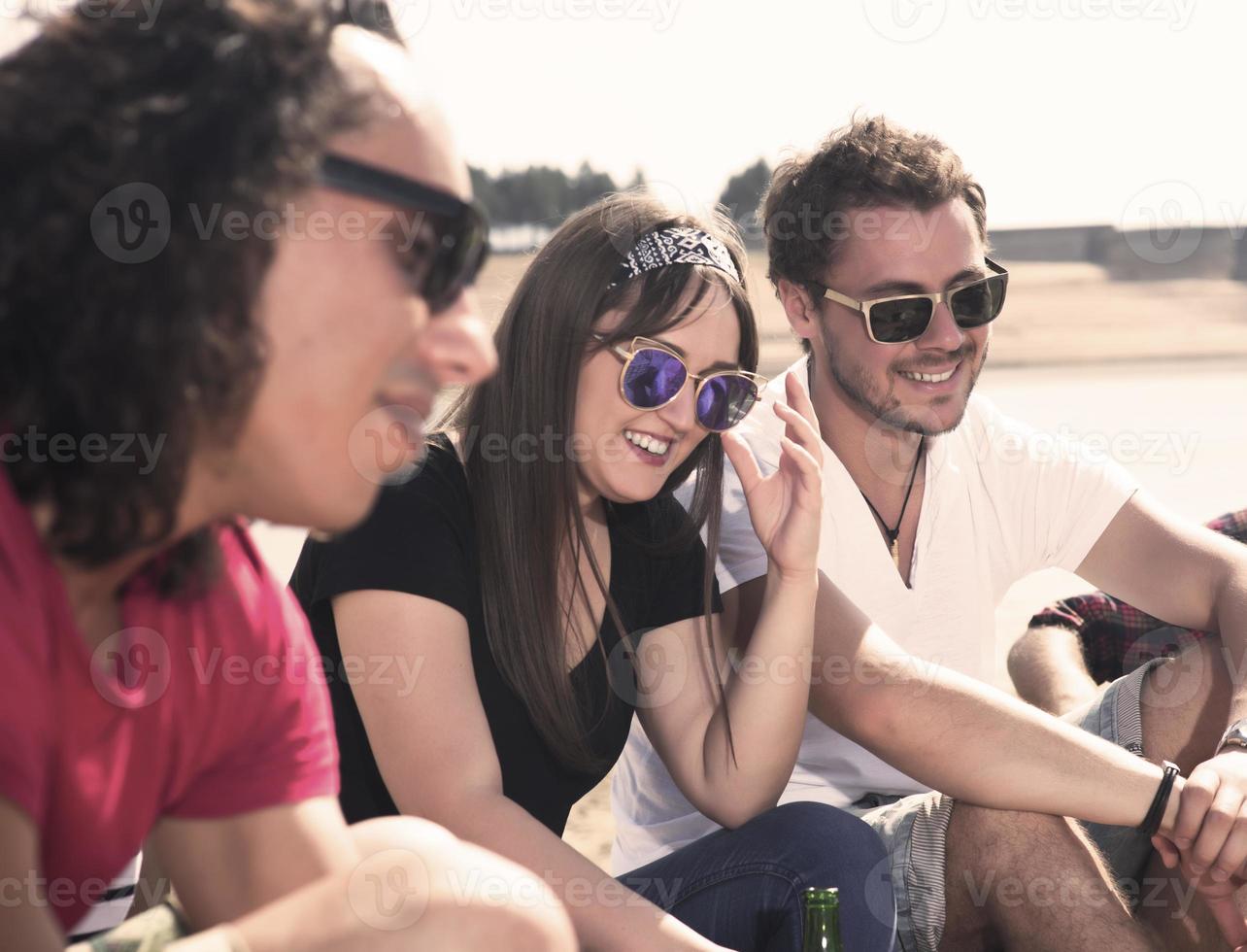 Happy friends camping party playing music and enjoying bonfire in nature and lake, photo