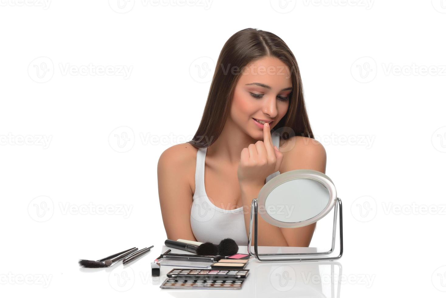 Female model checking irritated face skin photo