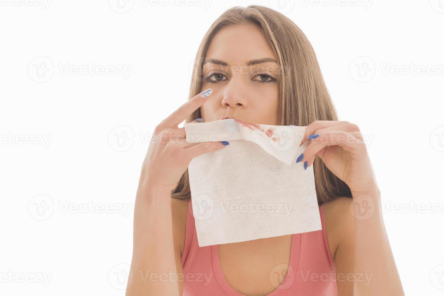 Beautiful woman sitting in front of a mirror. face of a healthy woman applying cream and makeup. Advertisement for skin cream, anti-wrinkle cream, baby face photo