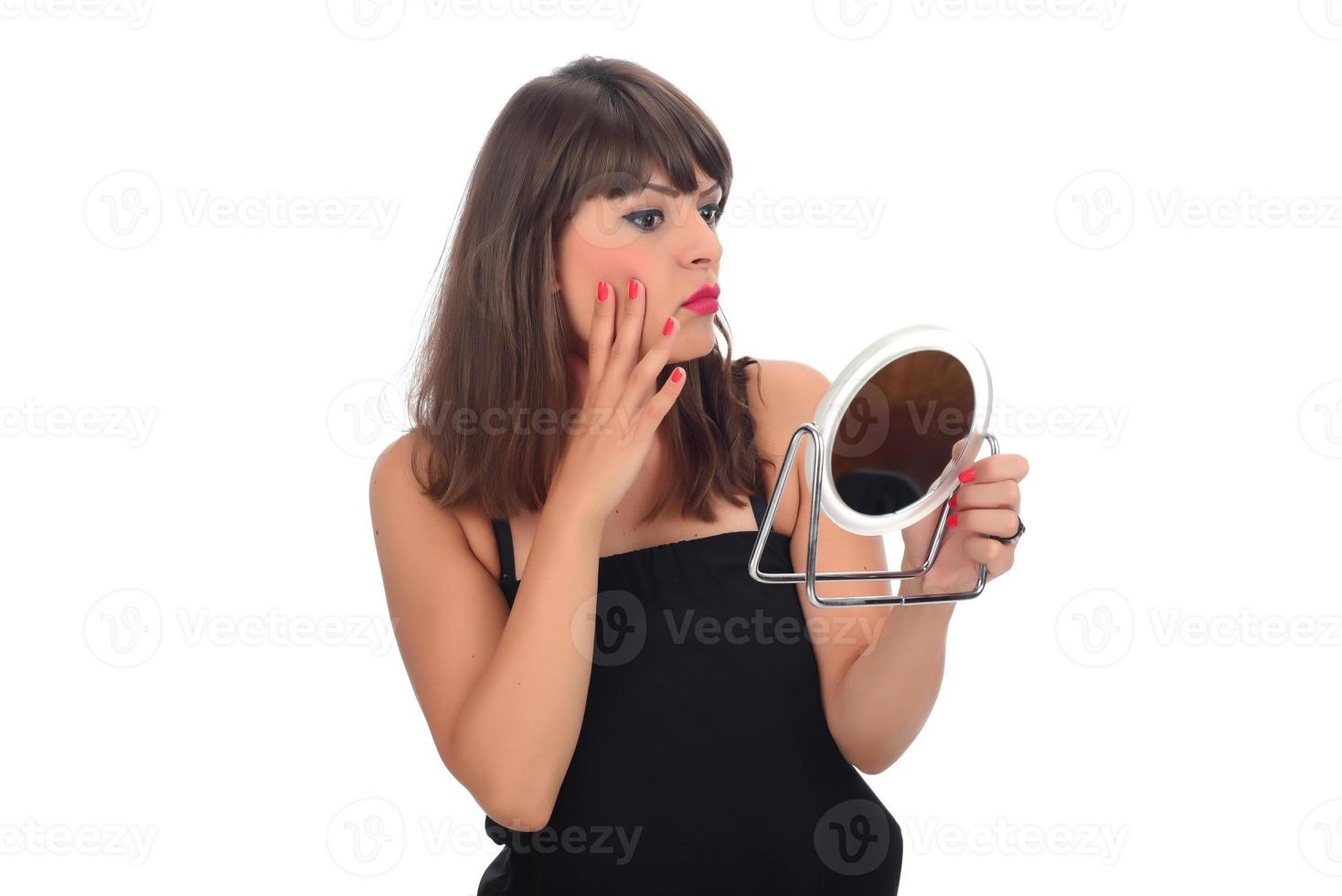 Portrait of attractive delicate feminine cheery girl touching smooth silky skin photo