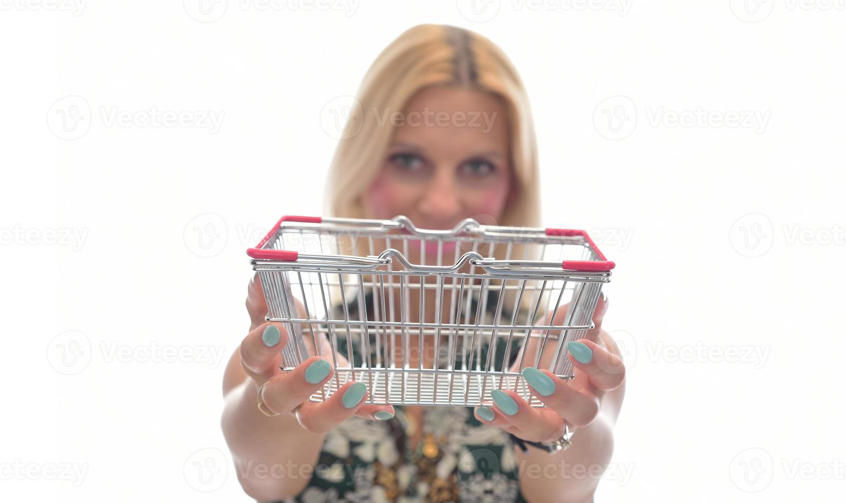 Woman thought about shopping. Girl is thinking about shopping.  Woman chooses where to make purchase. Woman shopper with trolley from supermarket. photo