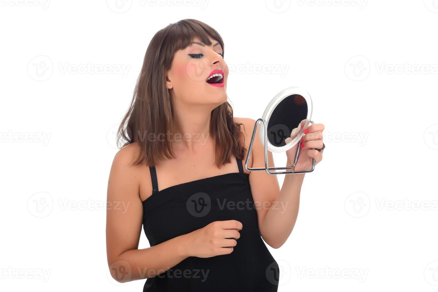 Portrait of attractive delicate feminine cheery girl touching smooth silky skin photo