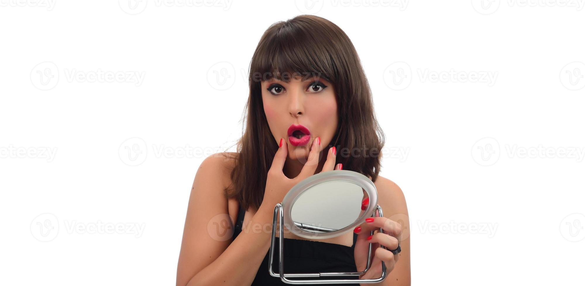 Portrait of attractive delicate feminine cheery girl touching smooth silky skin photo