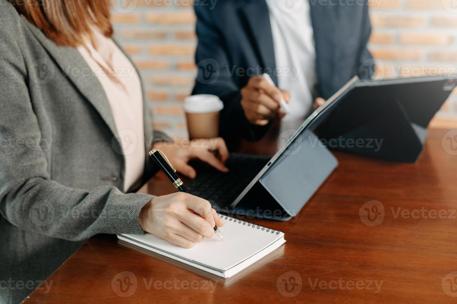 Business team meeting. professional investor working new start up project. Finance task. with smart phone and laptop and digital tablet computer  in morning light photo
