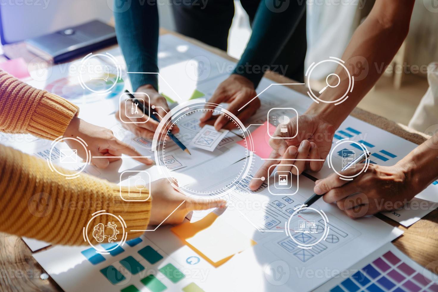 UX developer and ui designer brainstorming about mobile app interface wireframe design with customer breif and color code at office. with VR icon photo