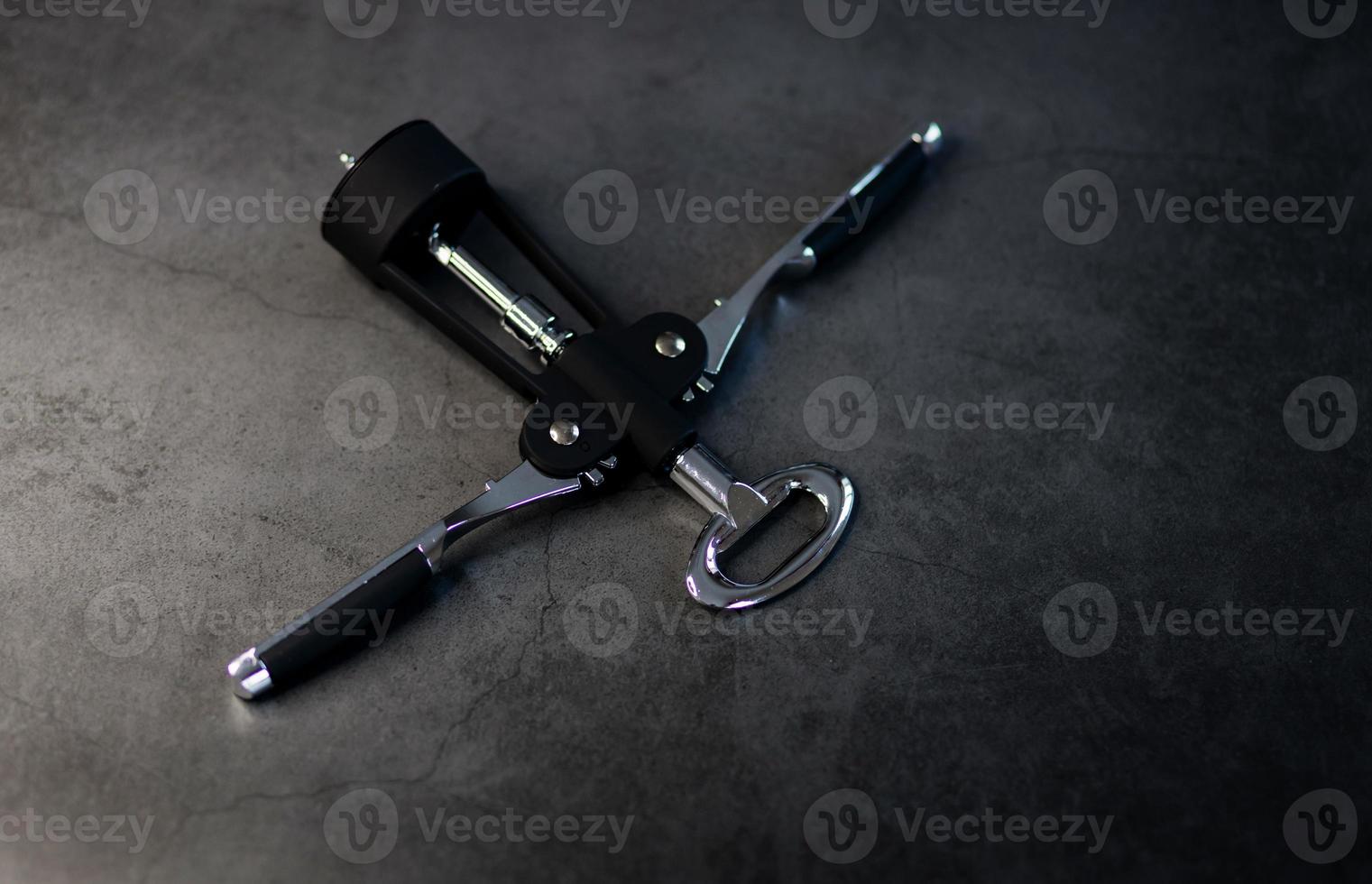 Sommelier corkscrew on table photo