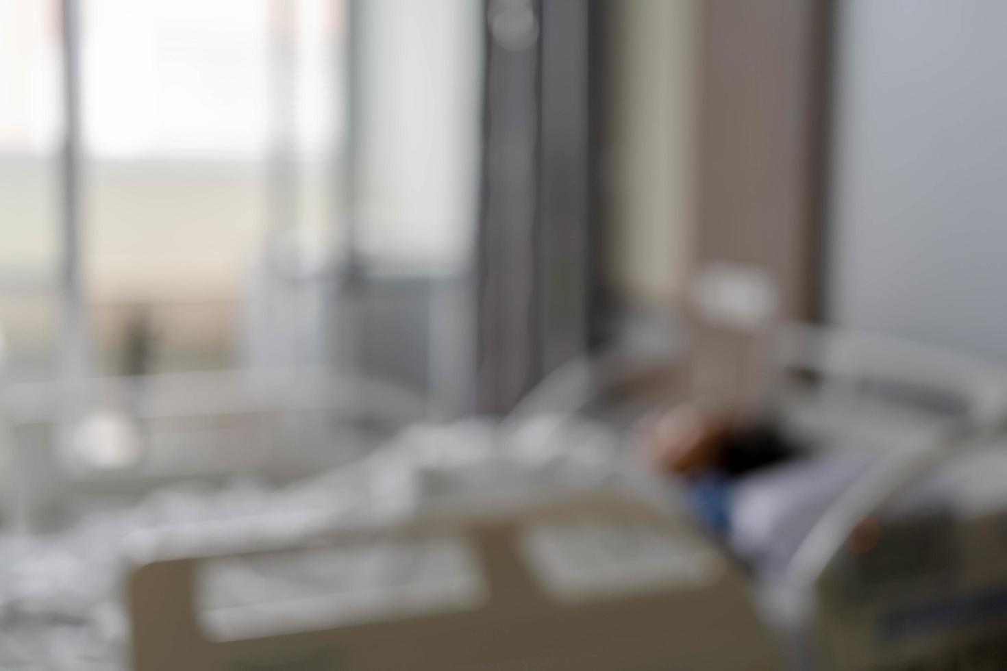 The blur of the sick patient get treatment on the bed inside the hospital elegant beautiful. picture for background. Hospital concept. photo