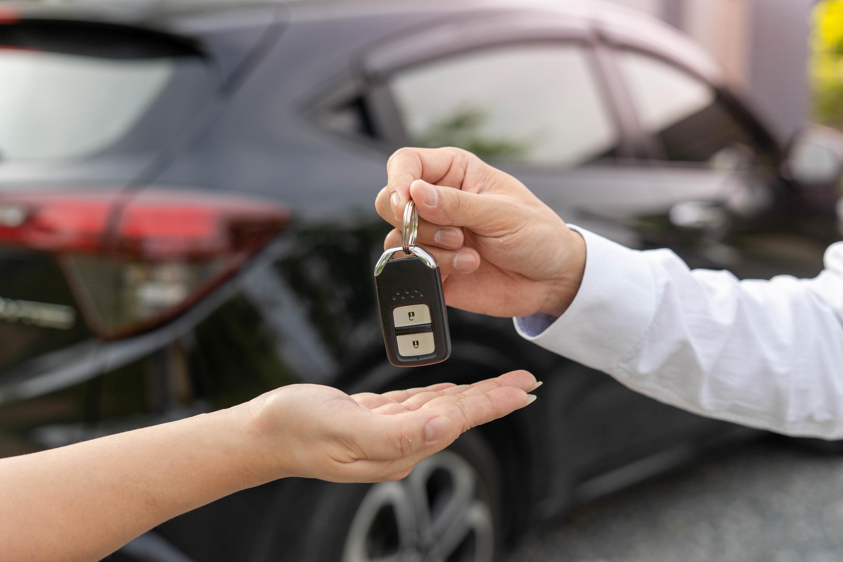 lease, rental car, sell, buy. Dealership manager send car keys to the