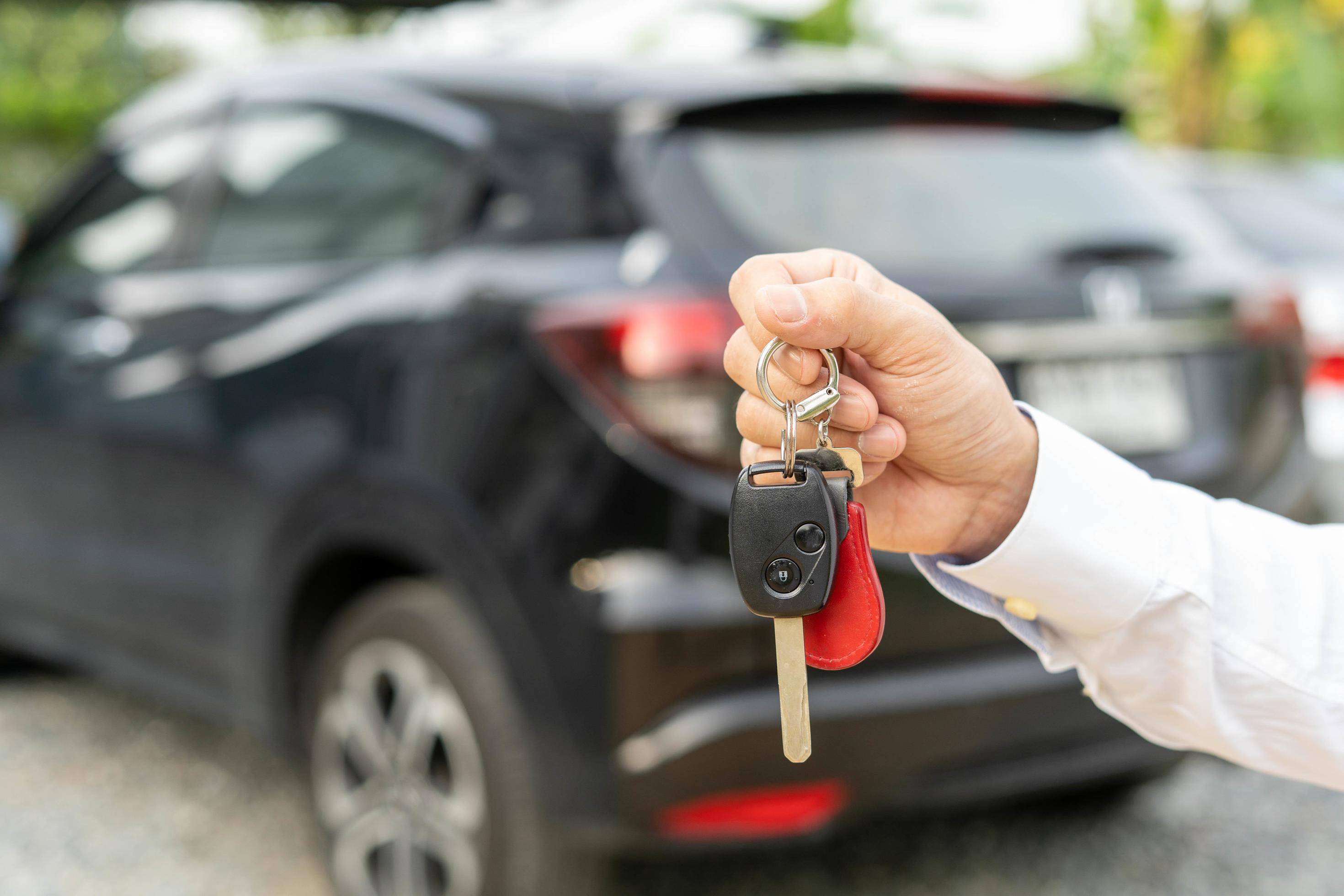 lease, rental car, sell, buy. Dealership manager send car keys to the