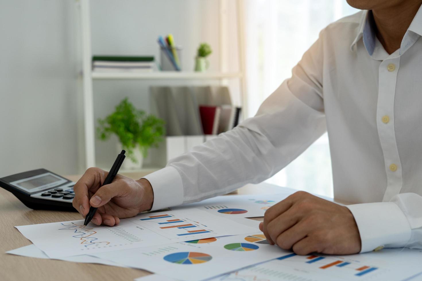 Business men looking at charts, spreadsheets, graph financial development, bank accounts, statistics, economy, data analysis, investment analysis, stock exchange,Interest rates, income photo