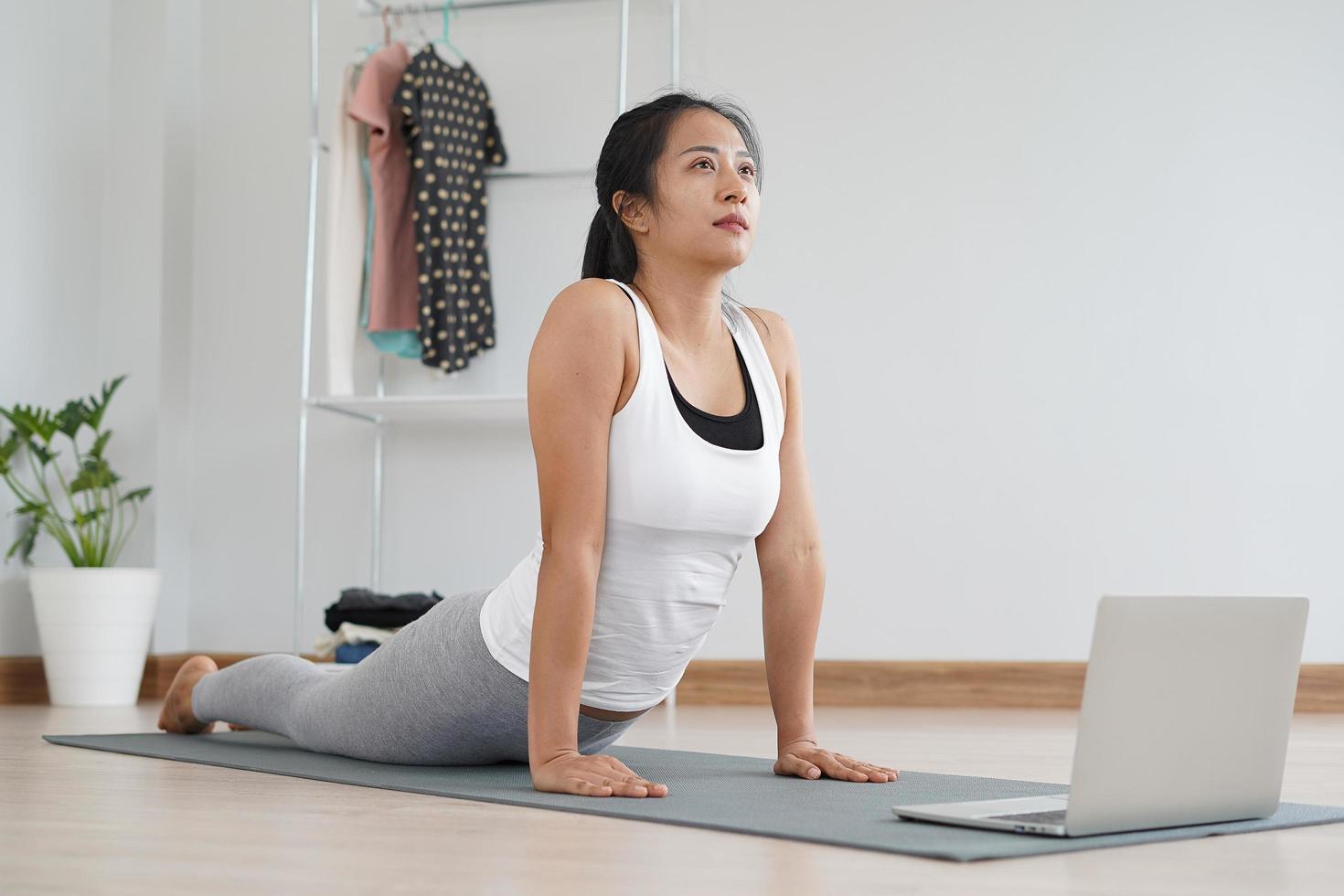 woman practicing meditate on the park. Asian woman doing exercises in morning. balance, recreation, relaxation, calm, good health, happy, relax, healthy lifestyle, reduce stress, peaceful, Attitude photo