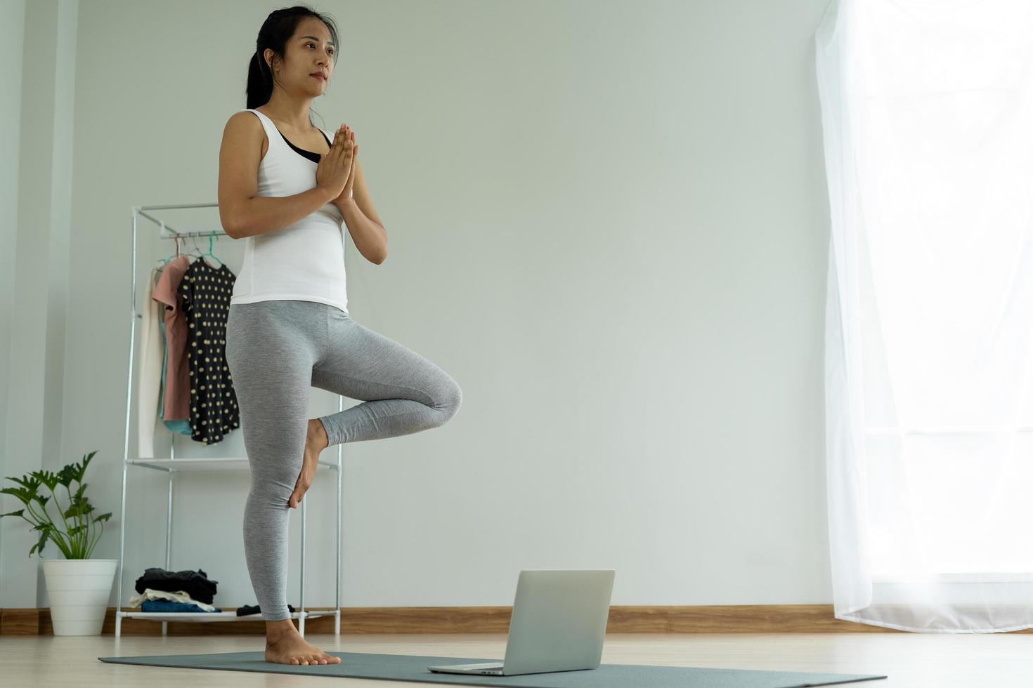 woman practicing meditate on the park. Asian woman doing exercises in morning. balance, recreation, relaxation, calm, good health, happy, relax, healthy lifestyle, reduce stress, peaceful, Attitude photo