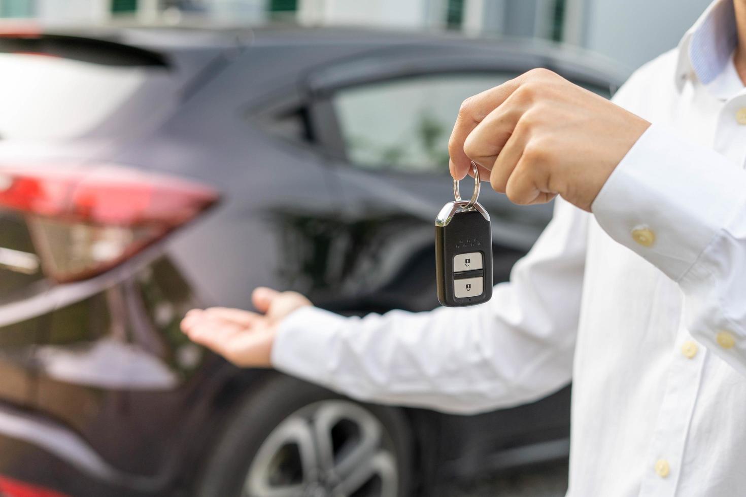 lease, rental car, sell, buy. Dealership manager send car keys to the new owner. Sales, loan