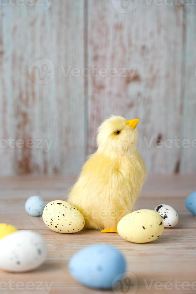 Chicken surrounded with colorful eggs.Happy easter vertical card photo