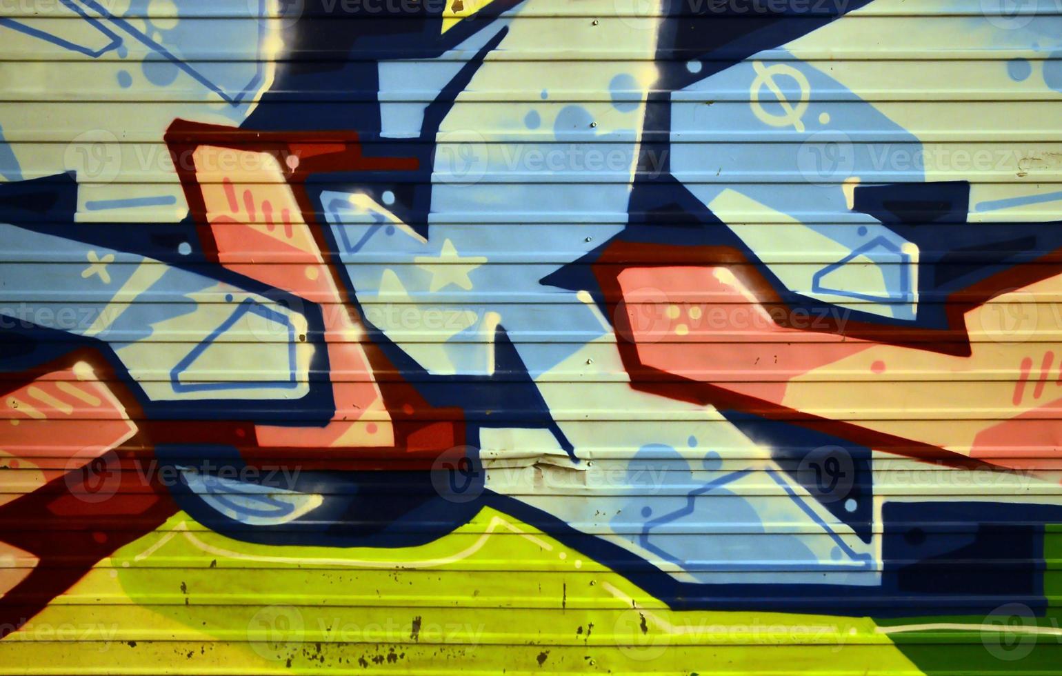 Background image with graffiti elements. Texture of the wall, painted in different colors of in the graffiti style. Concept of street culture, youth entertainment and illegal hooliganism photo