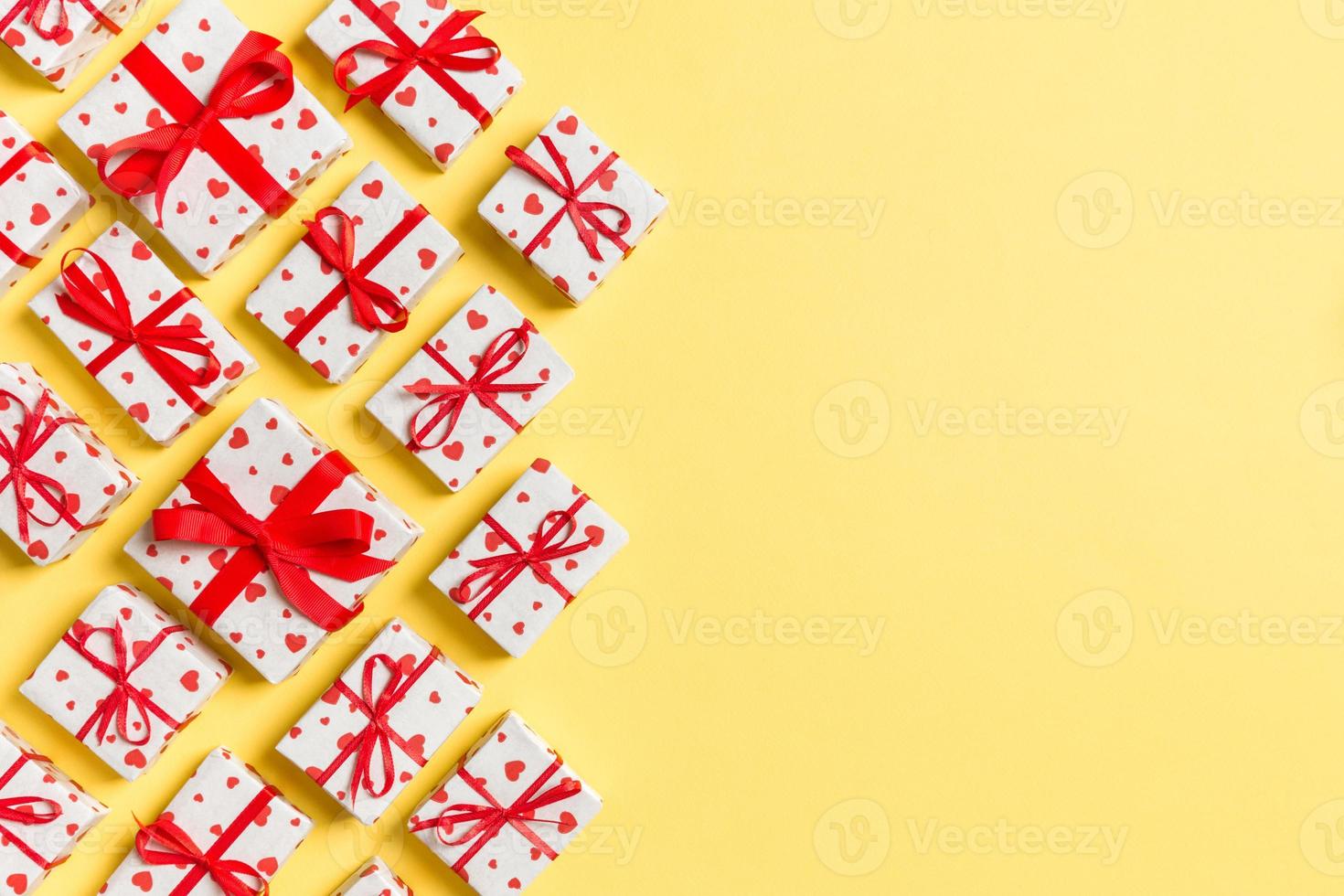 Top view of gift boxes with red hearts on colorful background. St Valentine's day concept with copy space photo
