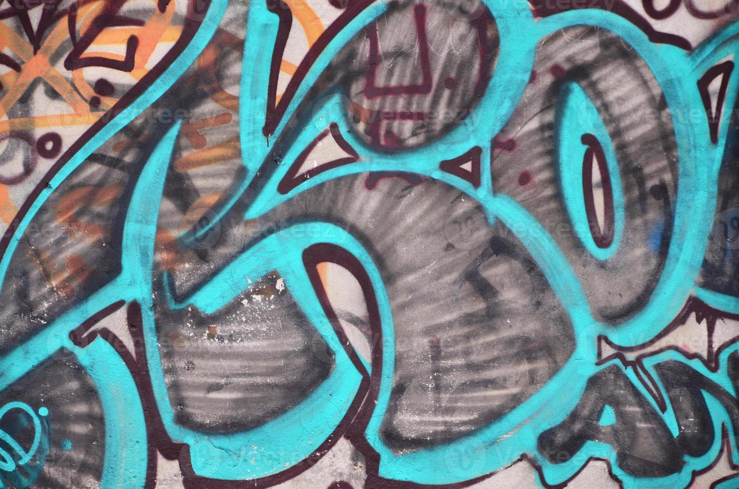 Background image with graffiti elements. Texture of the wall, painted in different colors of in the graffiti style. Concept of street culture, youth entertainment and illegal hooliganism photo