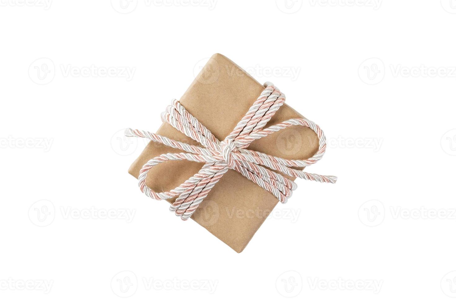 Gift box with pink ribbon isolated on white background. holiday concept you you design. top view photo