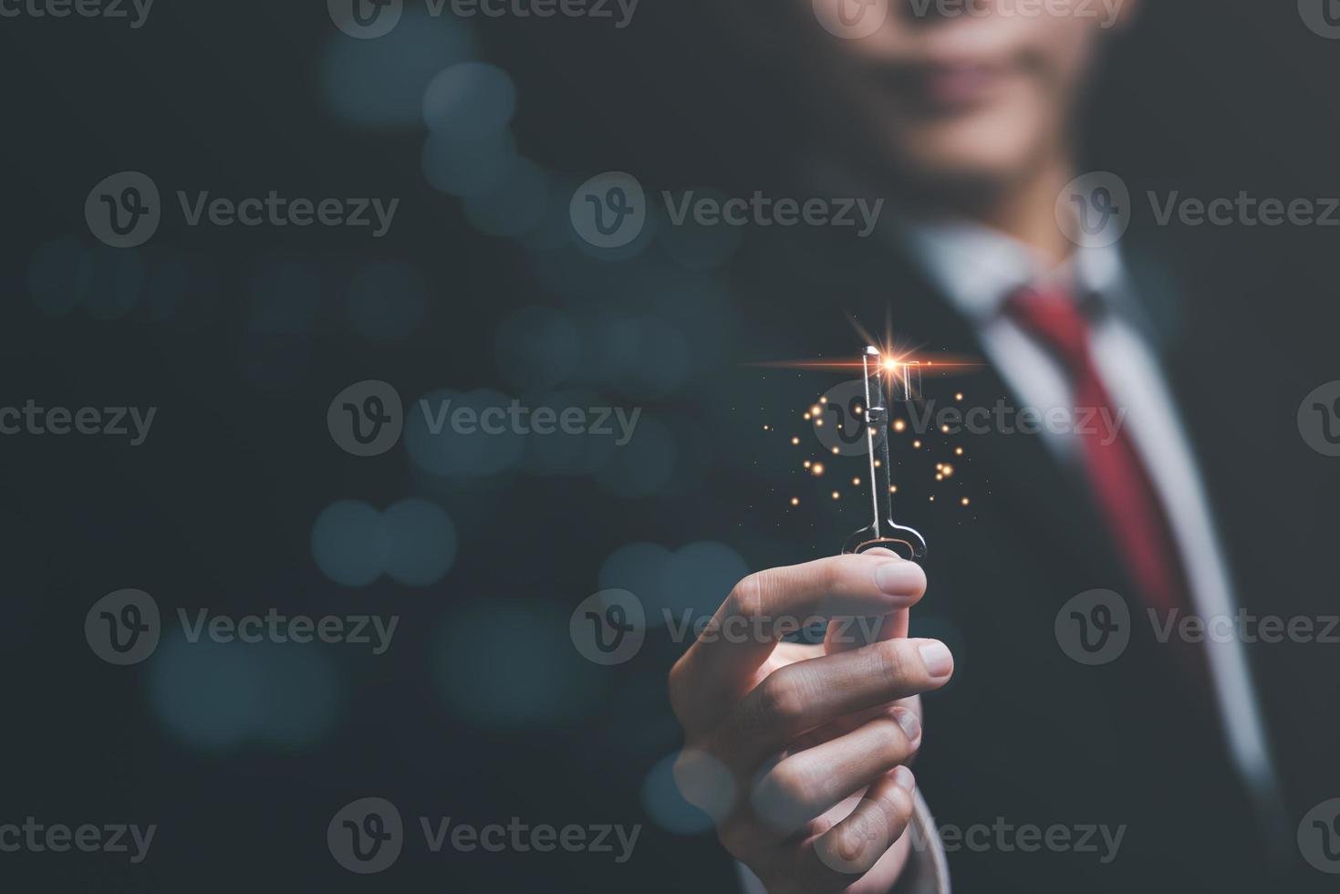 solution concept and demonstrating leadership strategies,that lead the business in a successful direction,with innovation and brain power from brainstorming,businessman holding a key photo