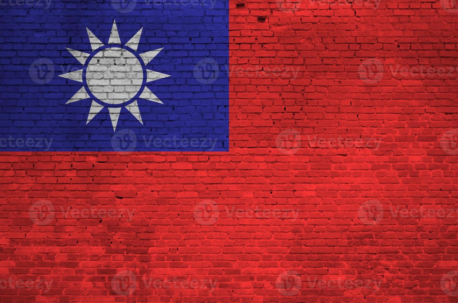 Taiwan flag depicted in paint colors on old brick wall. Textured banner on big brick wall masonry background photo