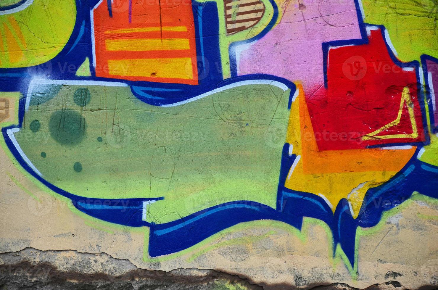 Background image with graffiti elements. Texture of the wall, painted in different colors of in the graffiti style. Concept of street culture, youth entertainment and illegal hooliganism photo
