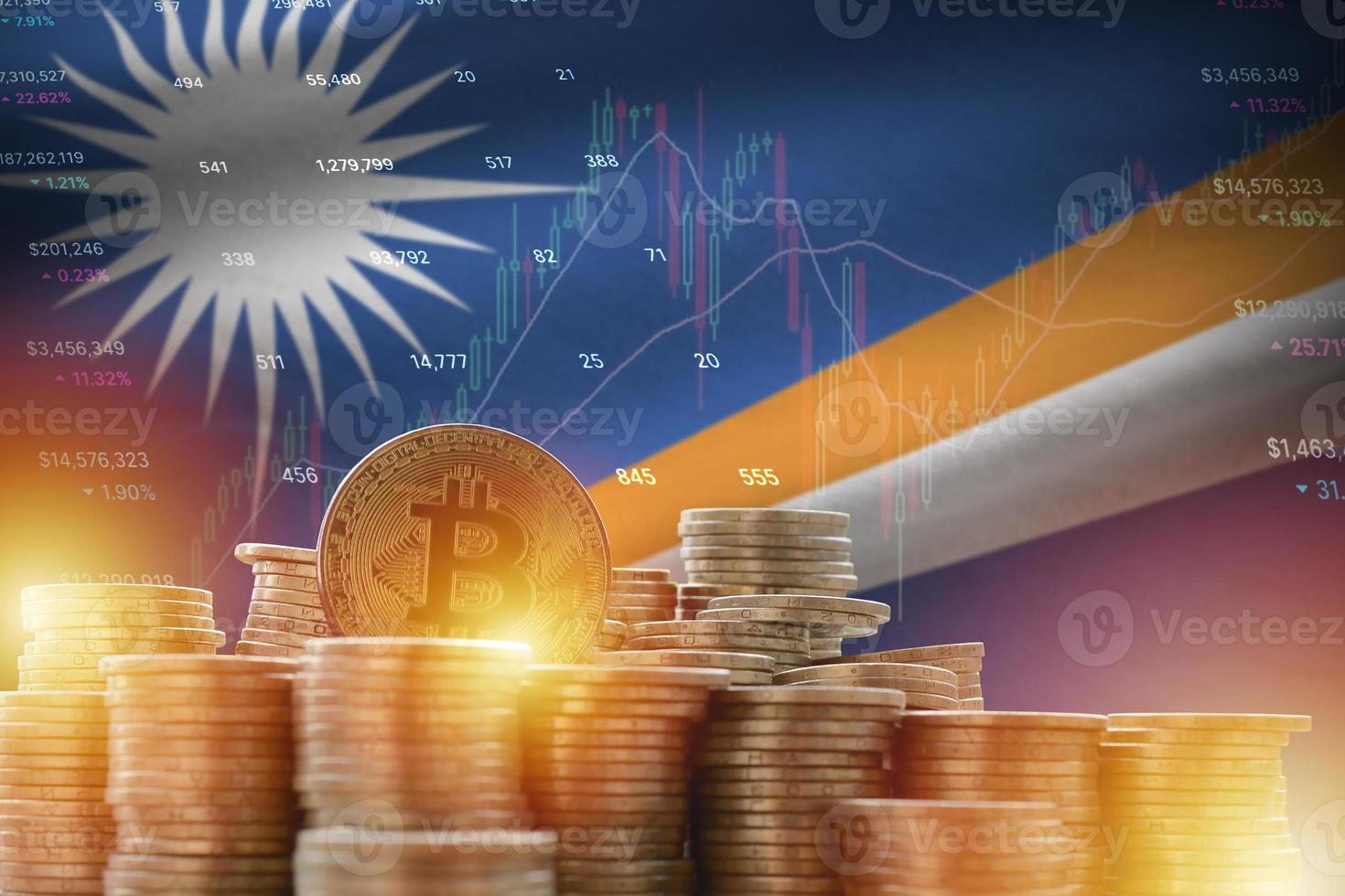 Marshall Islands flag and big amount of golden bitcoin coins and trading platform chart. Crypto currency photo