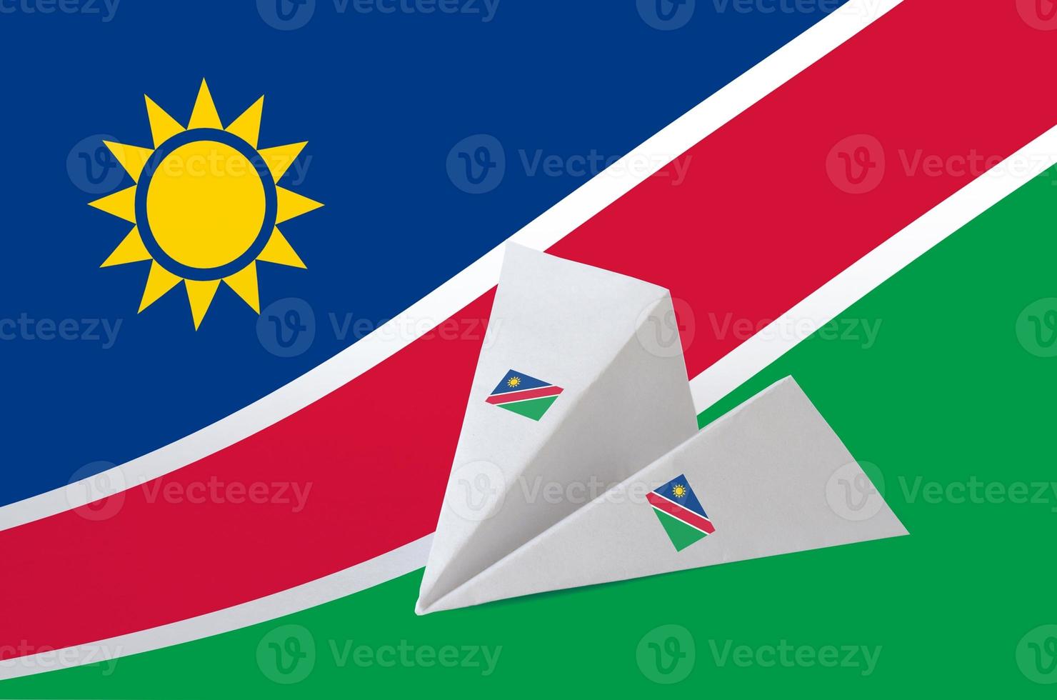 Namibia flag depicted on paper origami airplane. Handmade arts concept photo