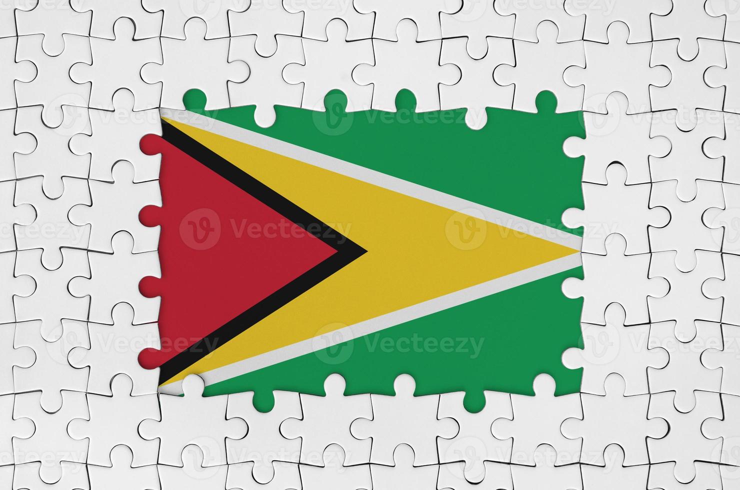 Guyana flag in frame of white puzzle pieces with missing central part photo