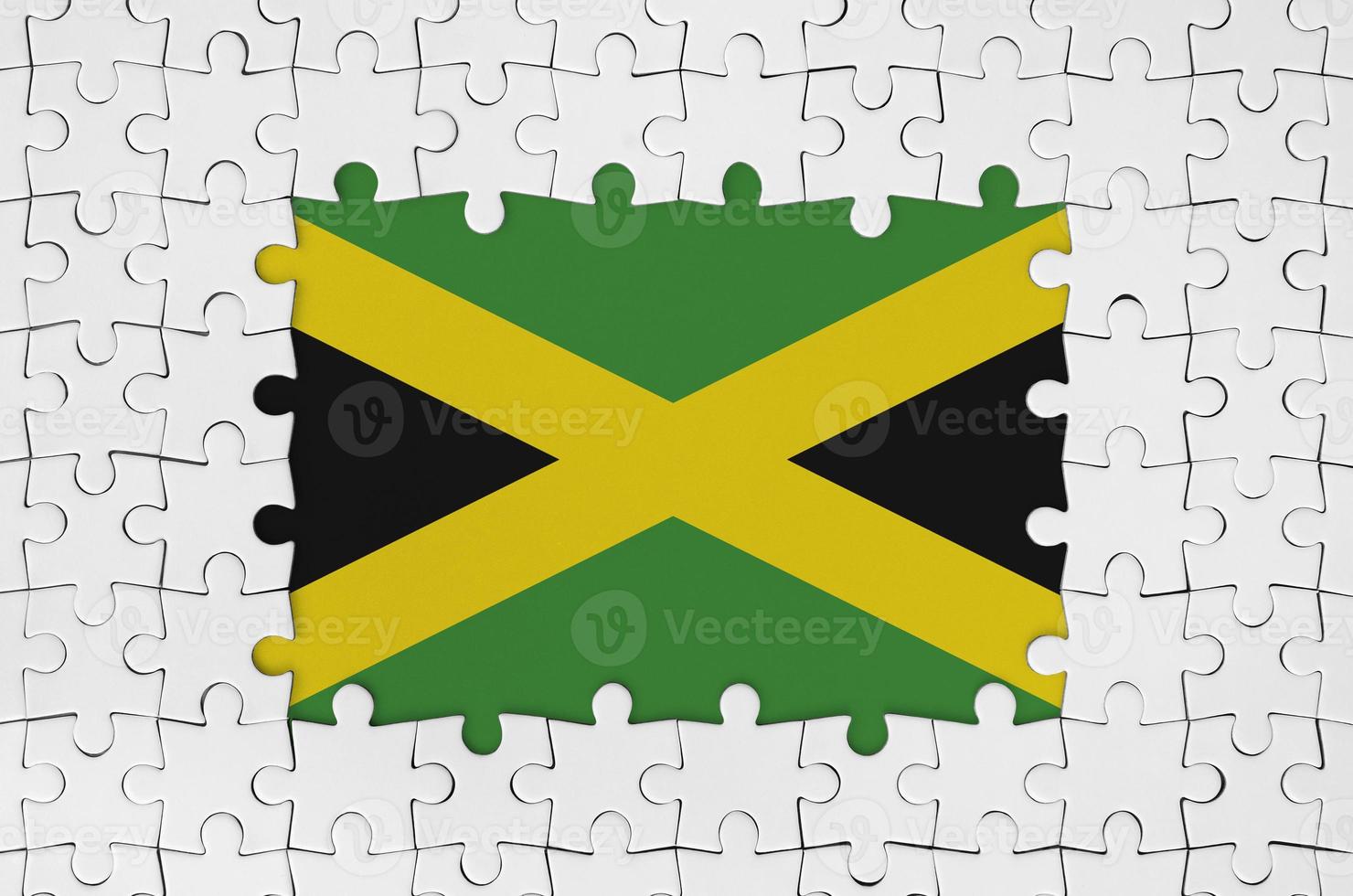 Jamaica flag in frame of white puzzle pieces with missing central part photo