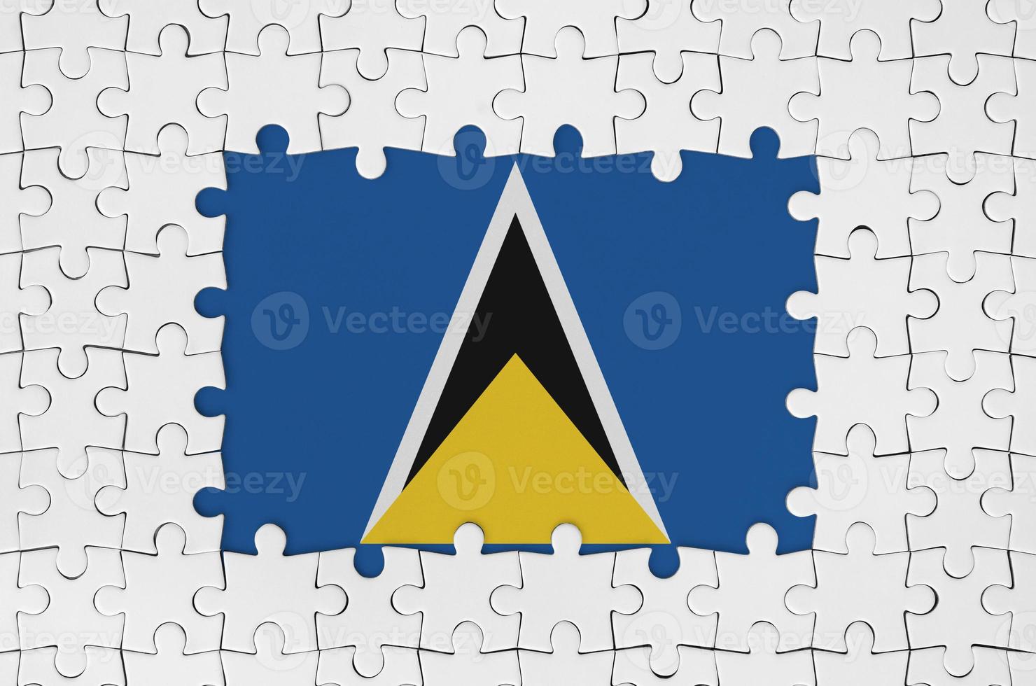 Saint Lucia flag in frame of white puzzle pieces with missing central part photo