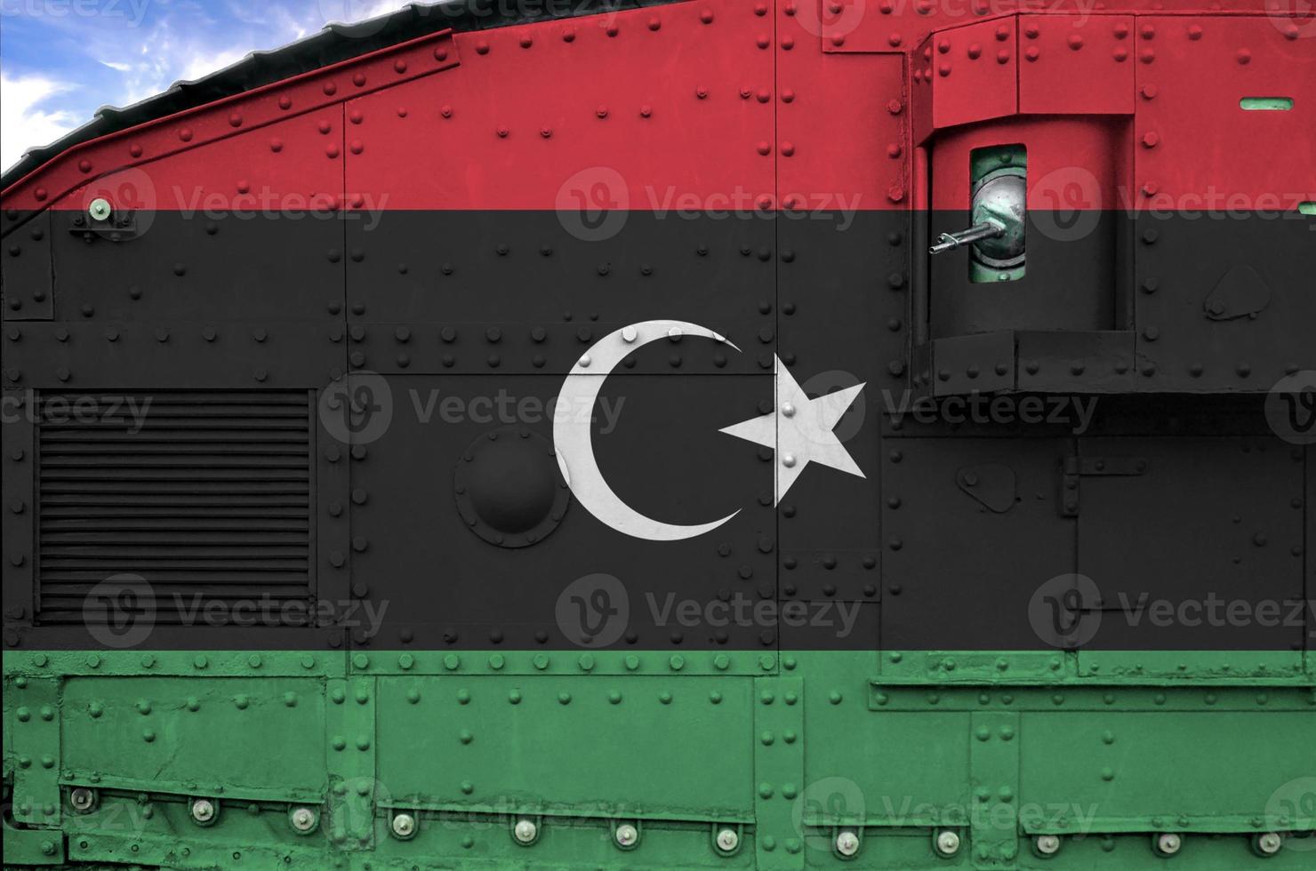 Libya flag depicted on side part of military armored tank closeup. Army forces conceptual background photo