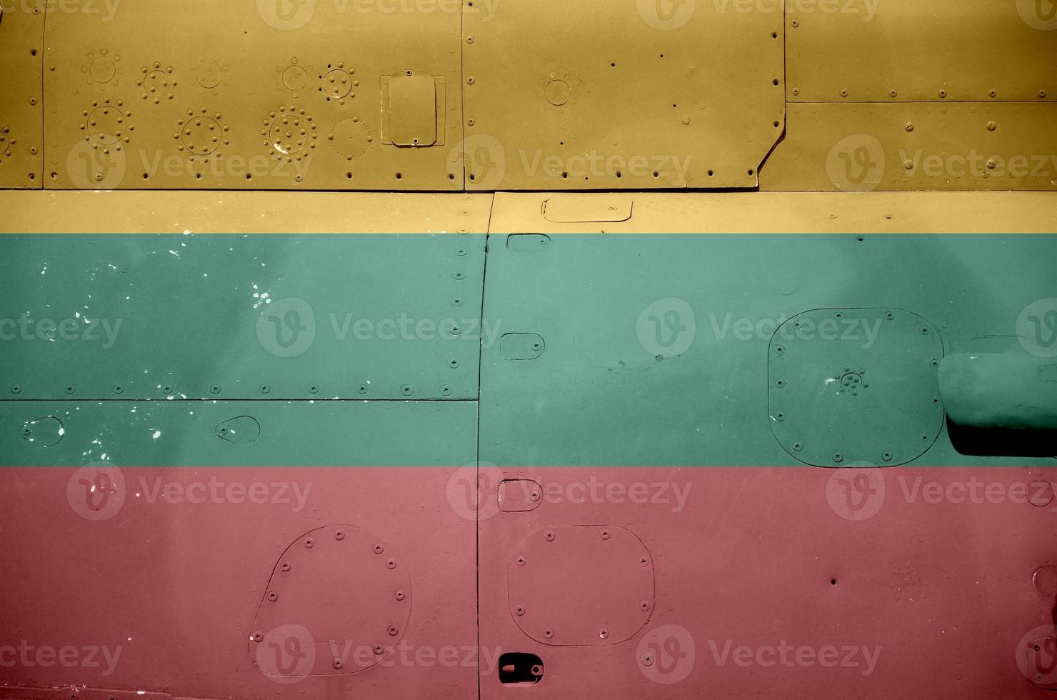Lithuania flag depicted on side part of military armored helicopter closeup. Army forces aircraft conceptual background photo