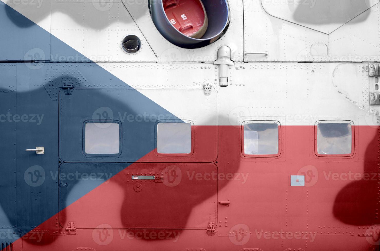 Czech flag depicted on side part of military armored helicopter closeup. Army forces aircraft conceptual background photo