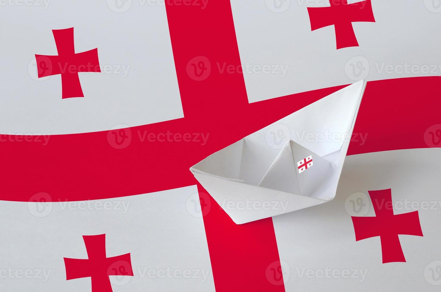 Georgia flag depicted on paper origami ship closeup. Handmade arts concept photo