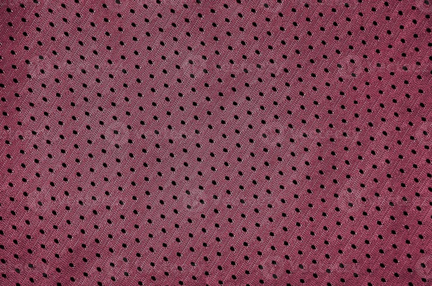 Fondo de textura de tela de ropa deportiva. vista superior de la superficie textil de tela. imagen tonificada en viva magenta, color del año 2023 foto