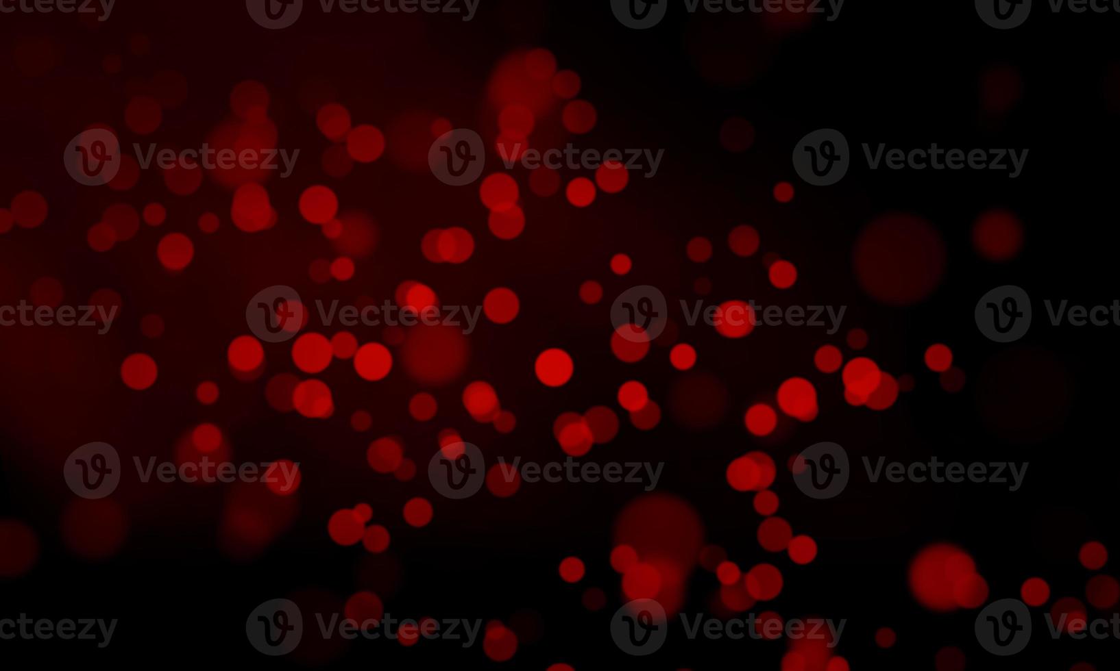 Red defocused lights on a dark background photo