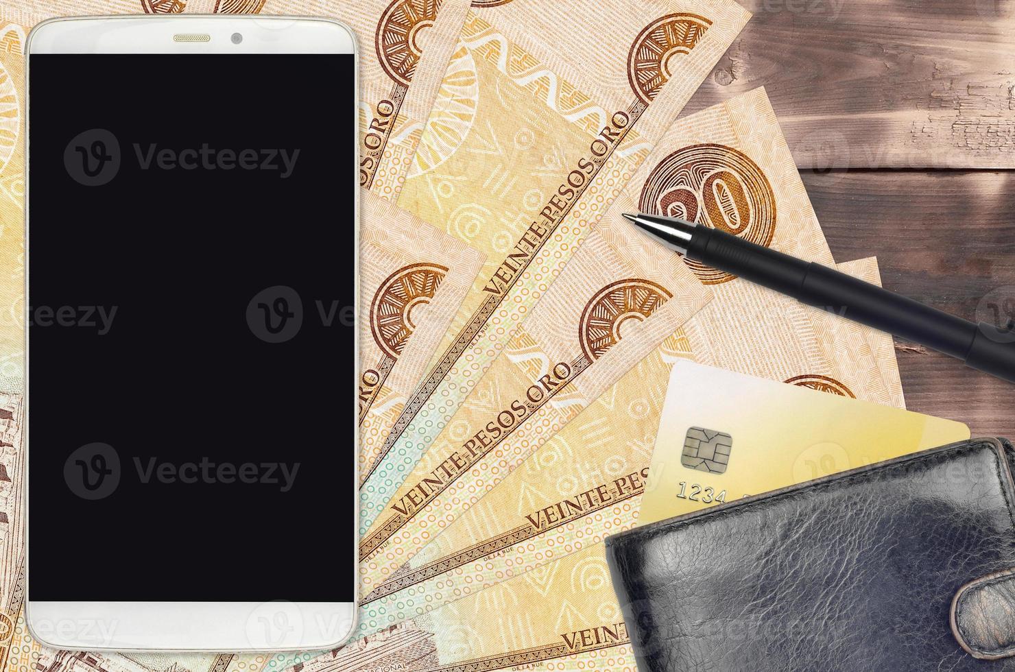 20 Dominican peso bills and smartphone with purse and credit card. E-payments or e-commerce concept. Online shopping and business with portable devices photo