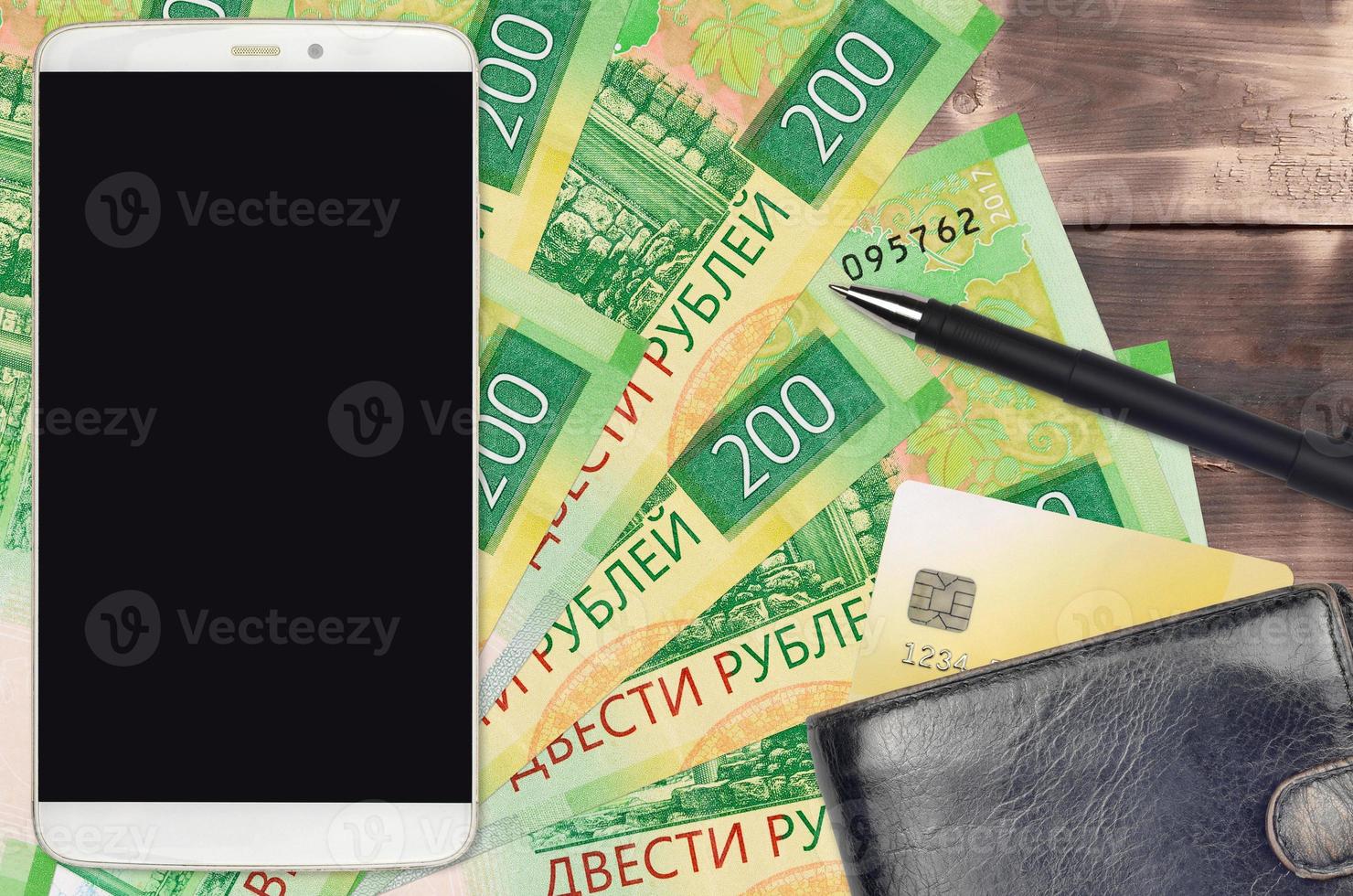 200 russian rubles bills and smartphone with purse and credit card. E-payments or e-commerce concept. Online shopping and business with portable devices photo