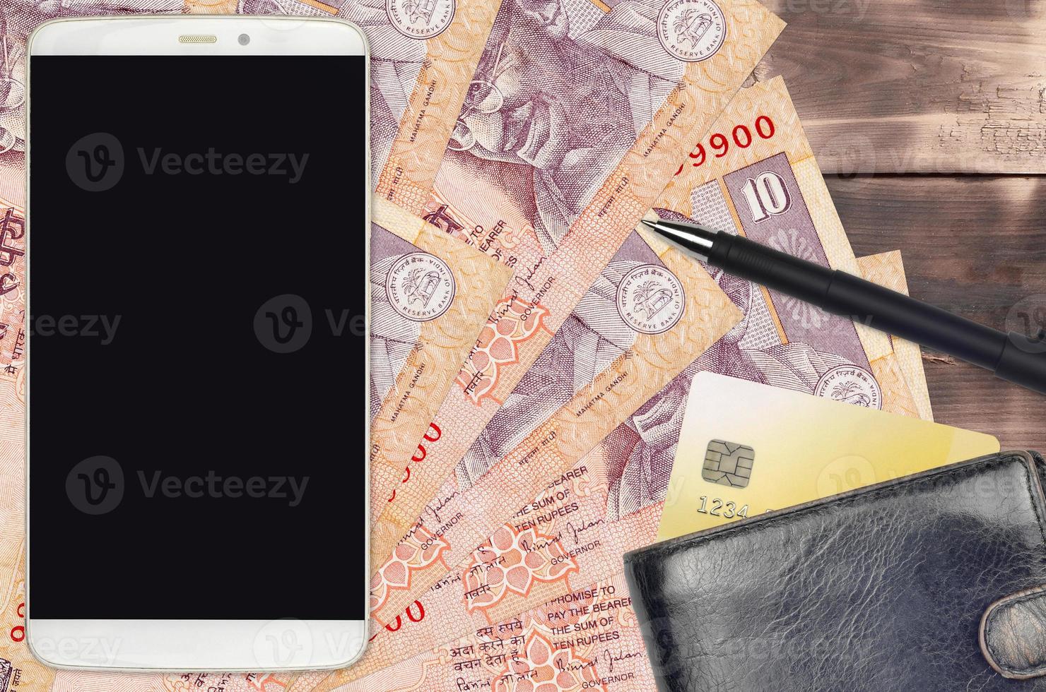 10 Indian rupees bills and smartphone with purse and credit card. E-payments or e-commerce concept. Online shopping and business with portable devices photo