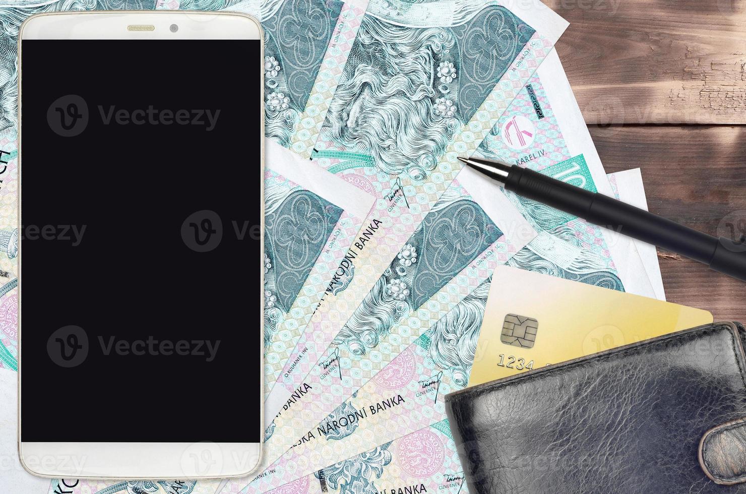 100 Czech korun bills and smartphone with purse and credit card. E-payments or e-commerce concept. Online shopping and business with portable devices photo